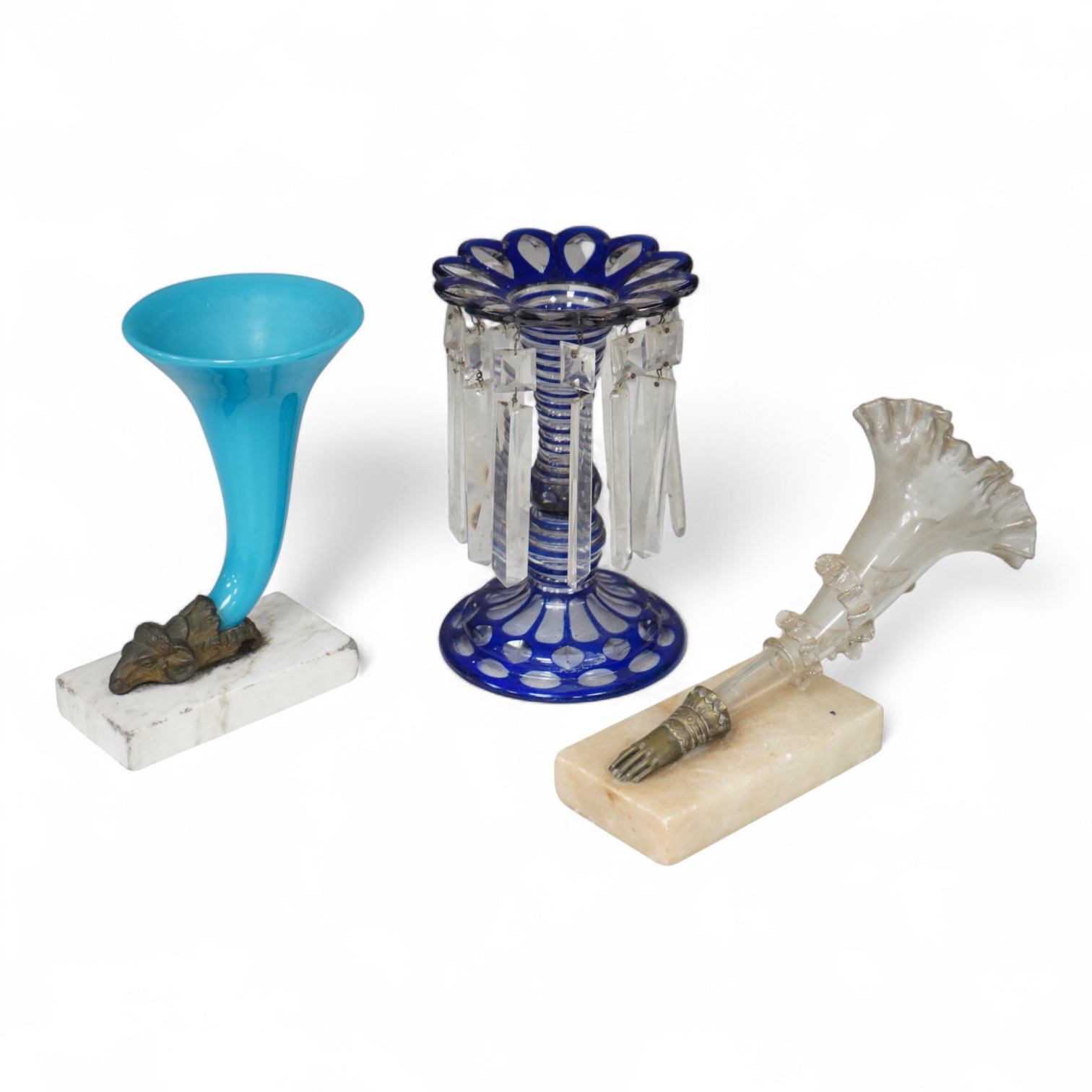 A late 19th century blue overlay glass table lustre and two late 19th century cornucopia shaped glass and brass mounted vases on stands
